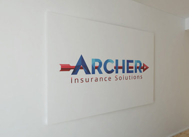 Archer Insurance Solutions logo printed on a wall