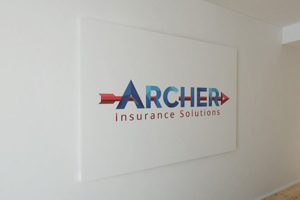 Archer Insurance Solutions logo printed on a wall
